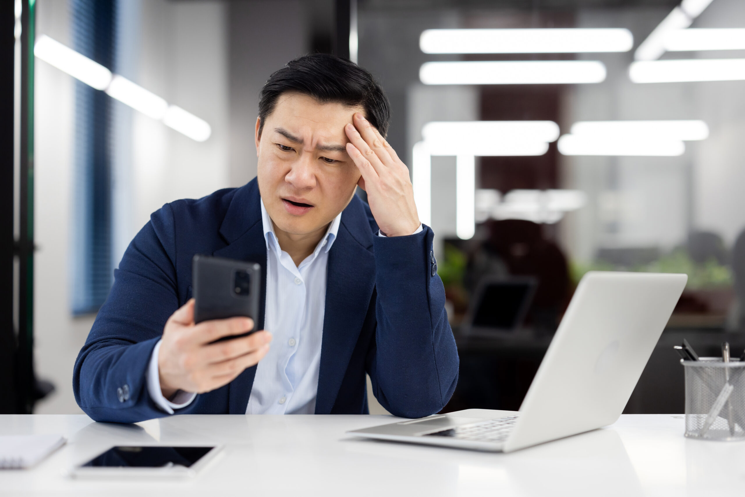 Business owner reviewing delivery information while deciding between courier service options